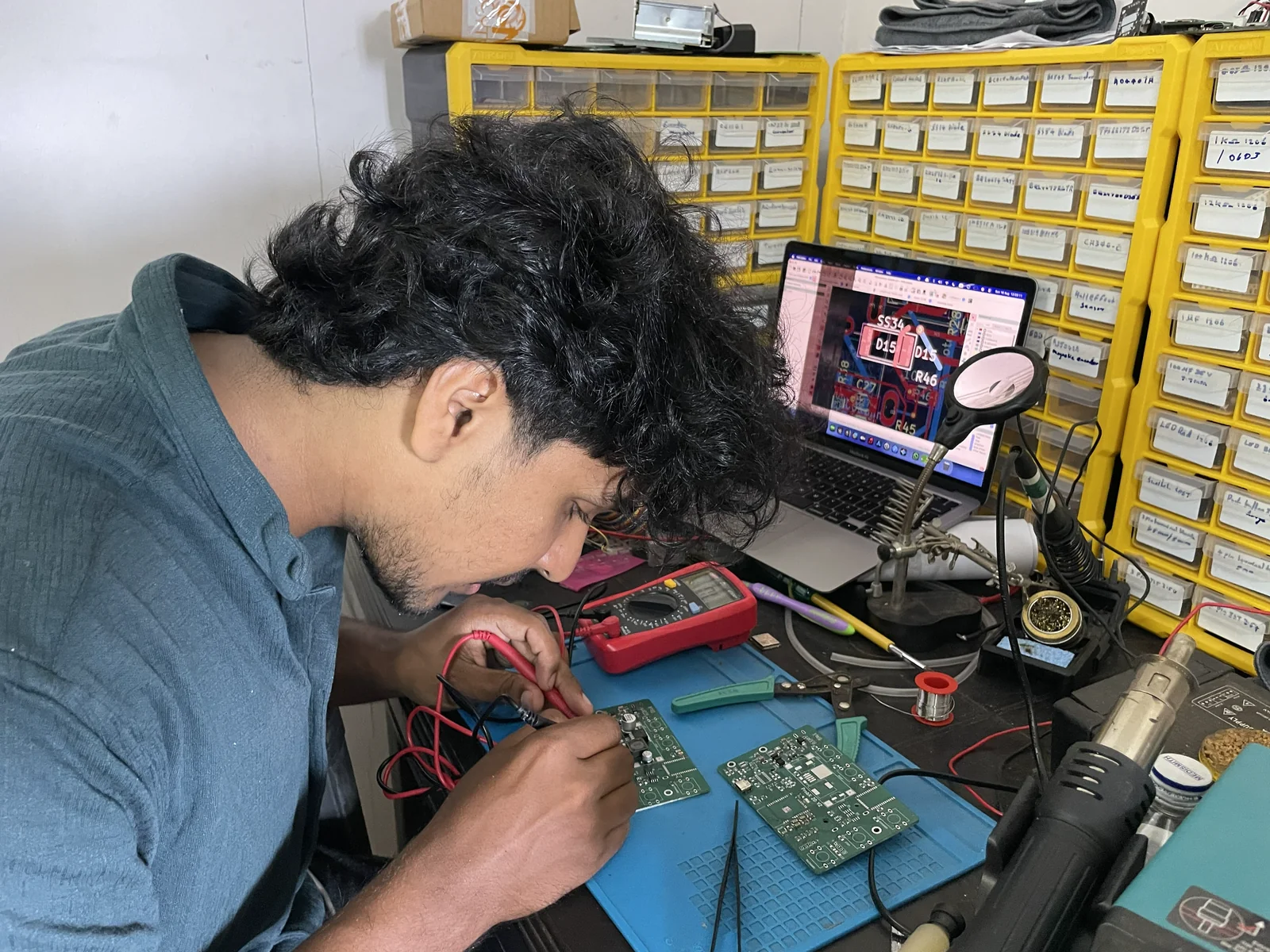 An engineer assembling electronics at the Xenon workbench